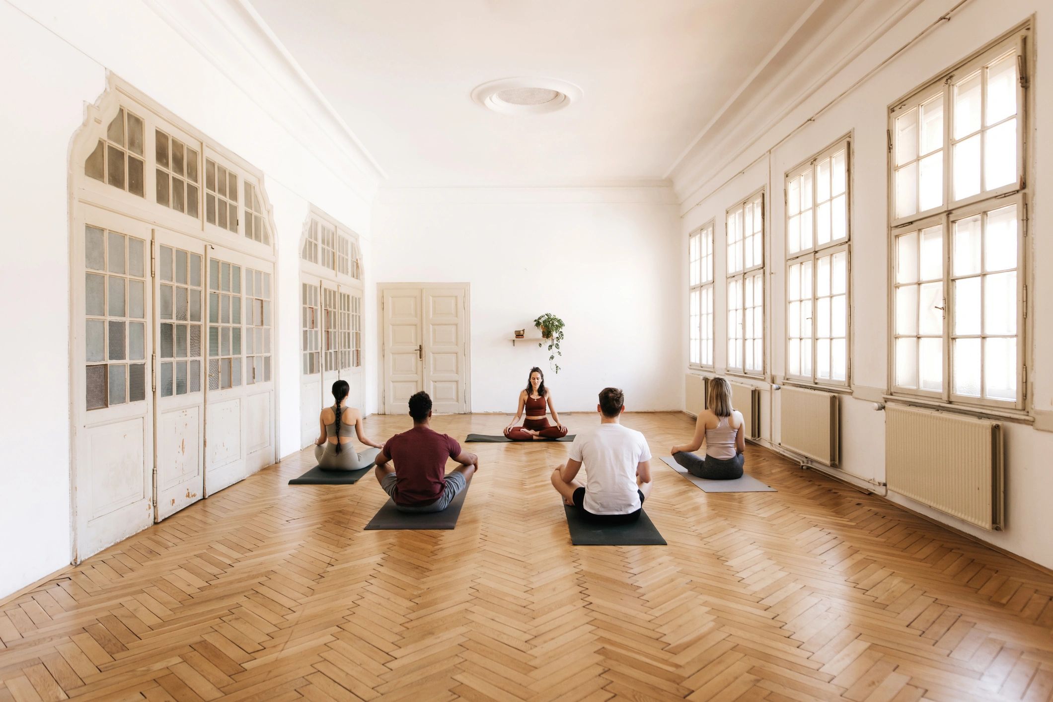 Group yoga class in a bright studio